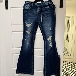 NWT Petra 153. DISTRESSED MID RISE STRETCH FLARE WITH TROUSER HEM.